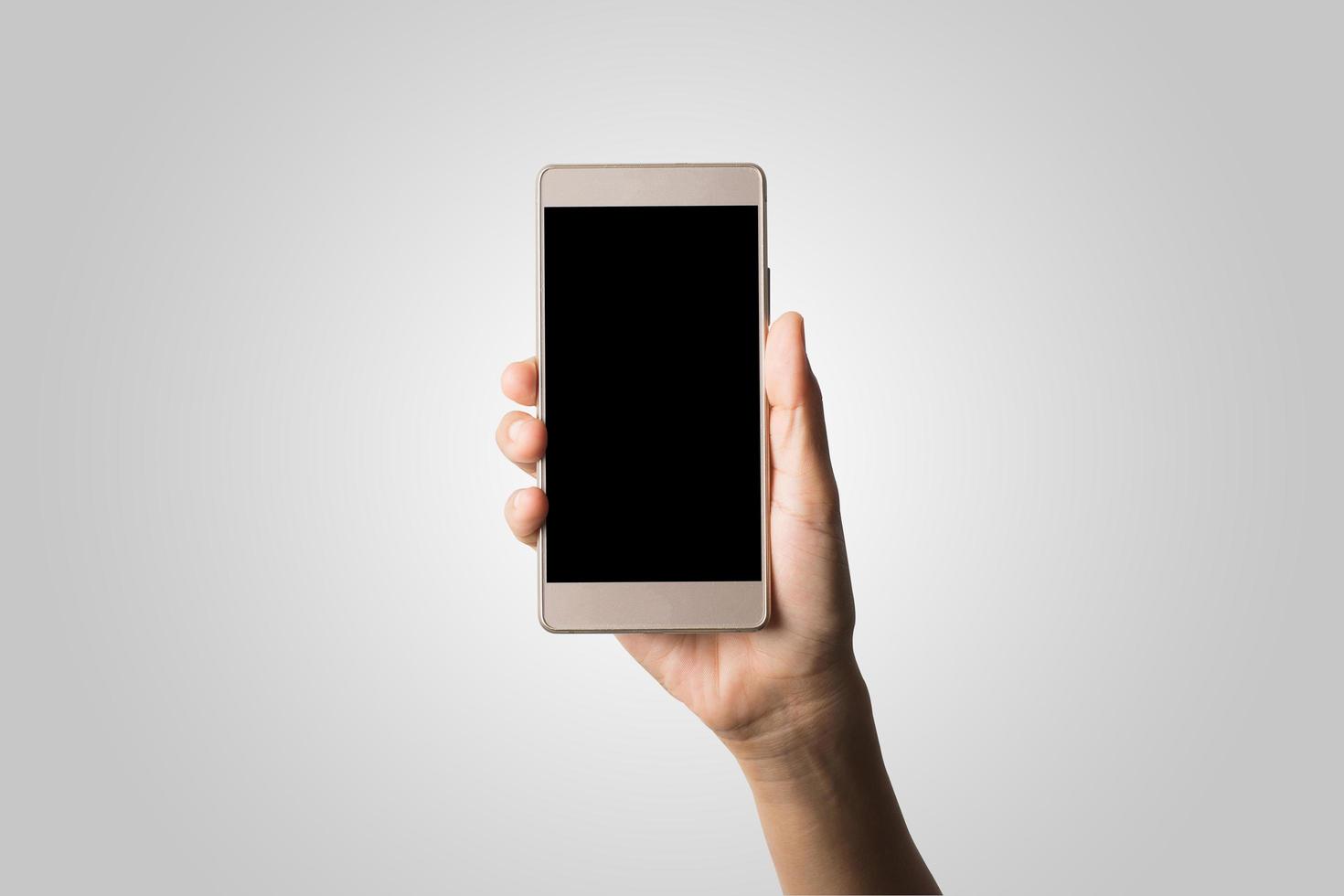 mano de mujer, tenencia, teléfono inteligente, pantalla en blanco foto