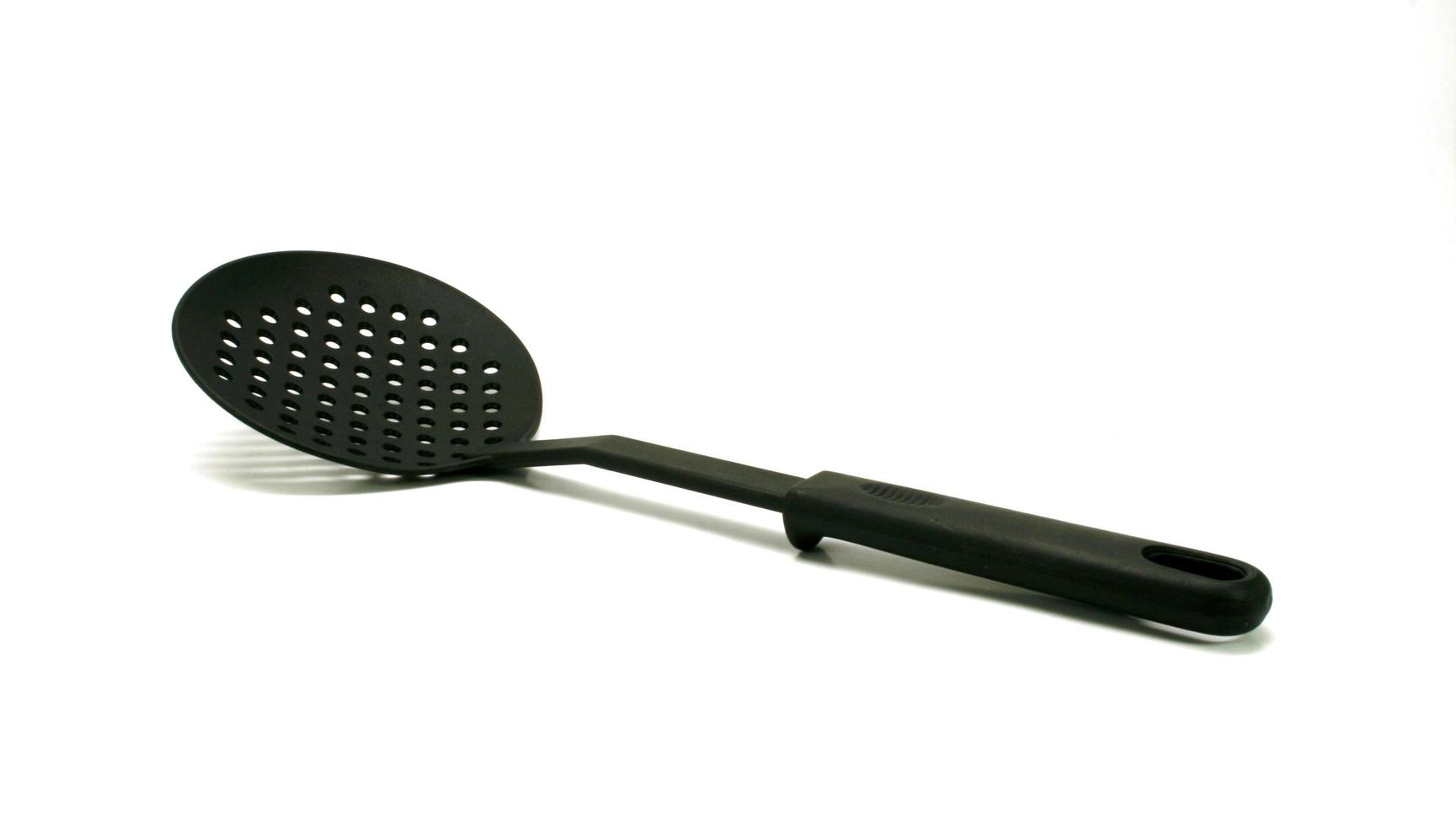 Plastic spatula on white photo