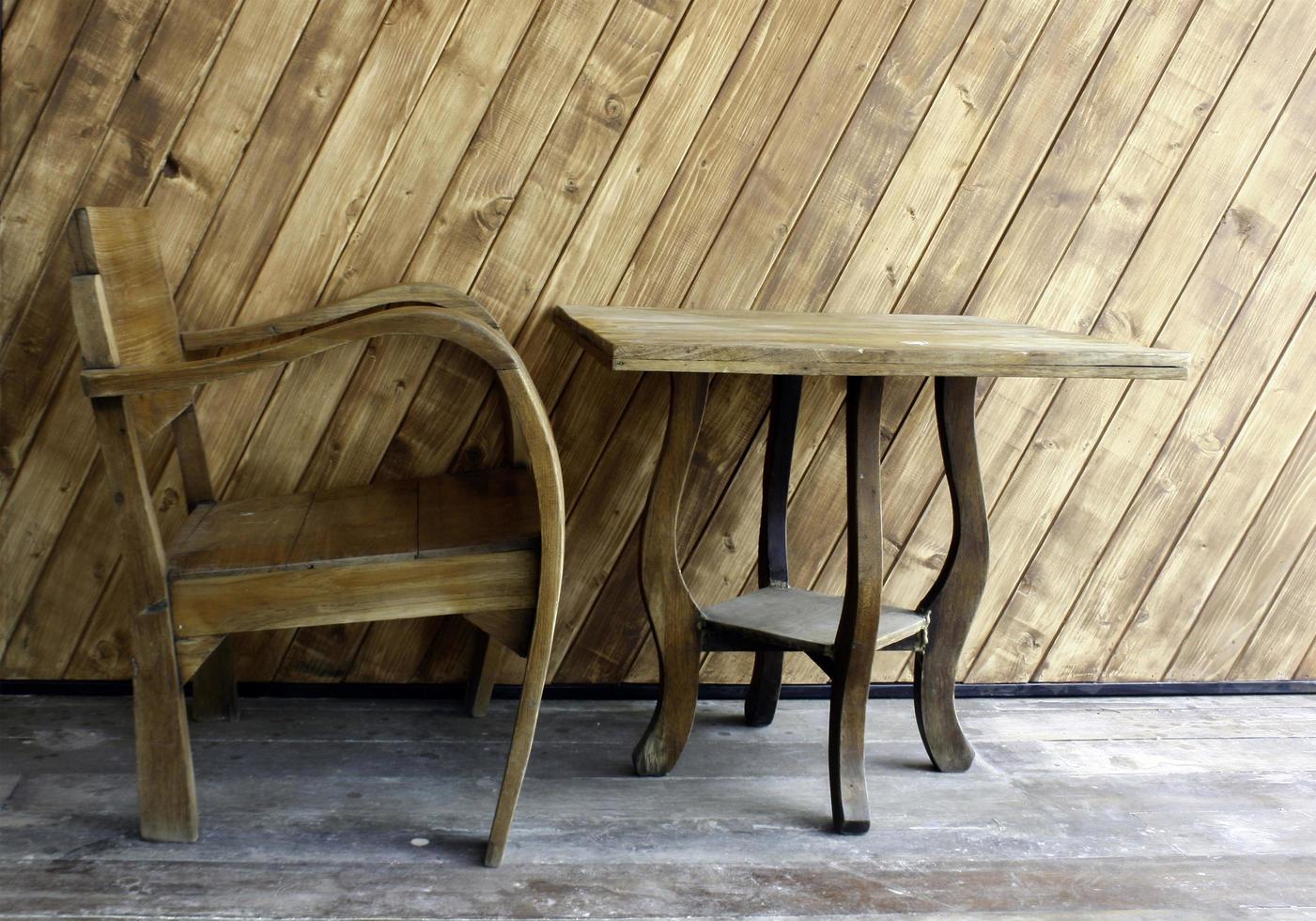 Natural wood table and chair photo