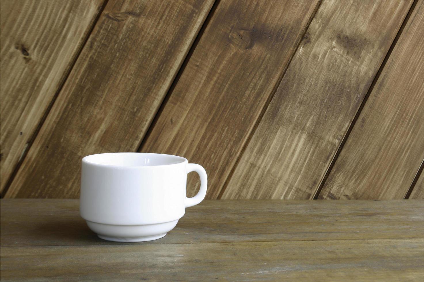 White cup against wood photo