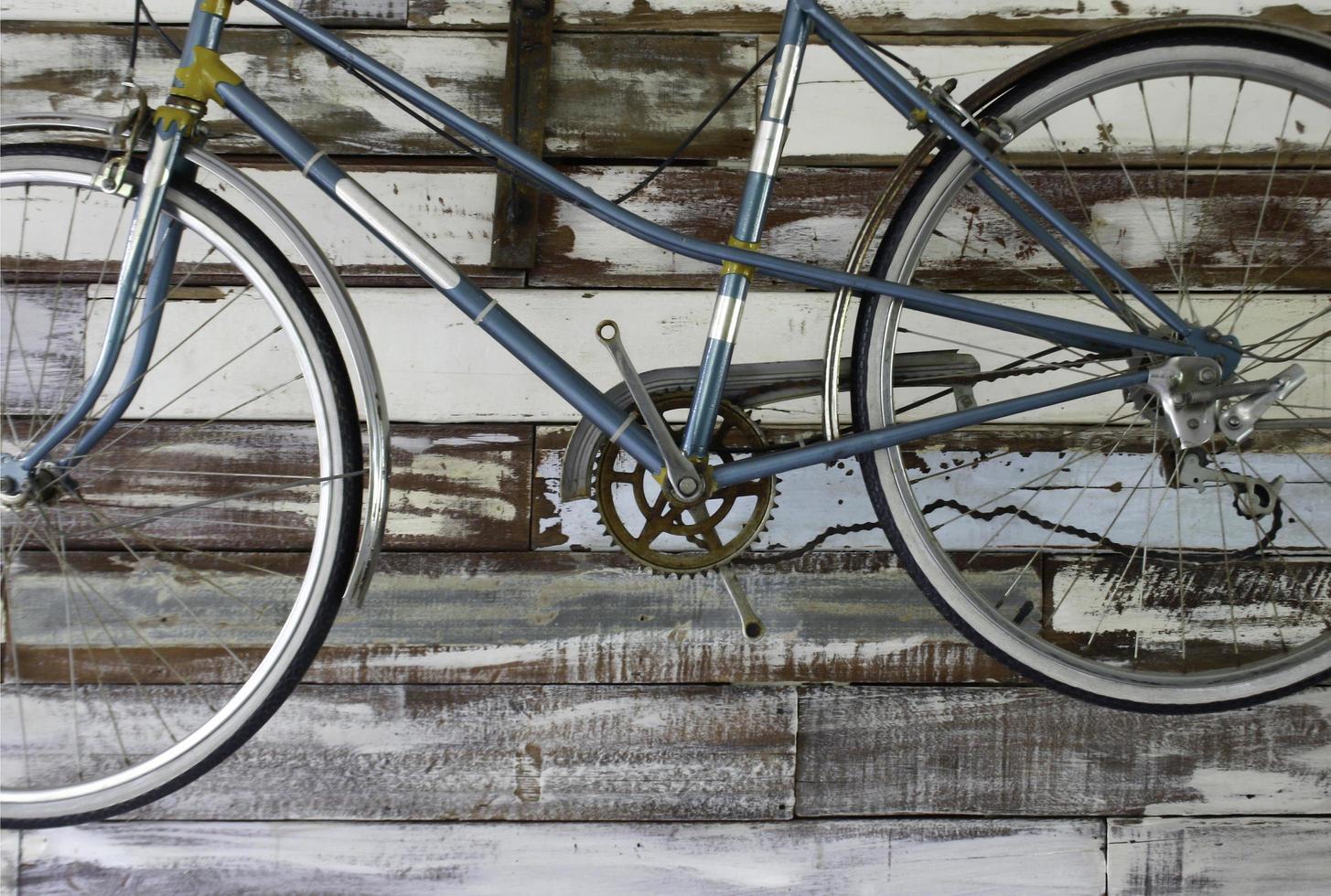 Antique bike on wall photo