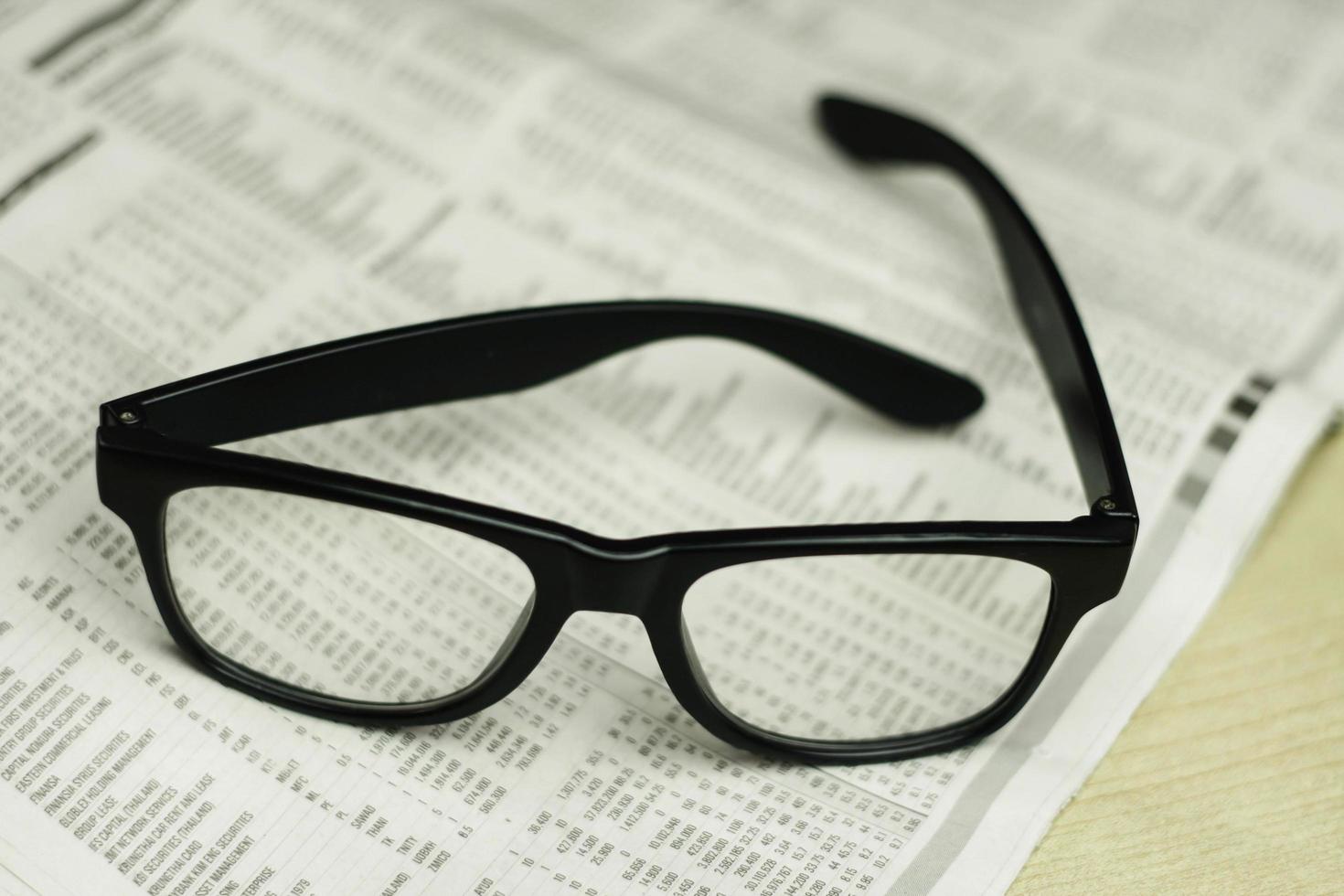 Glasses on newspaper photo