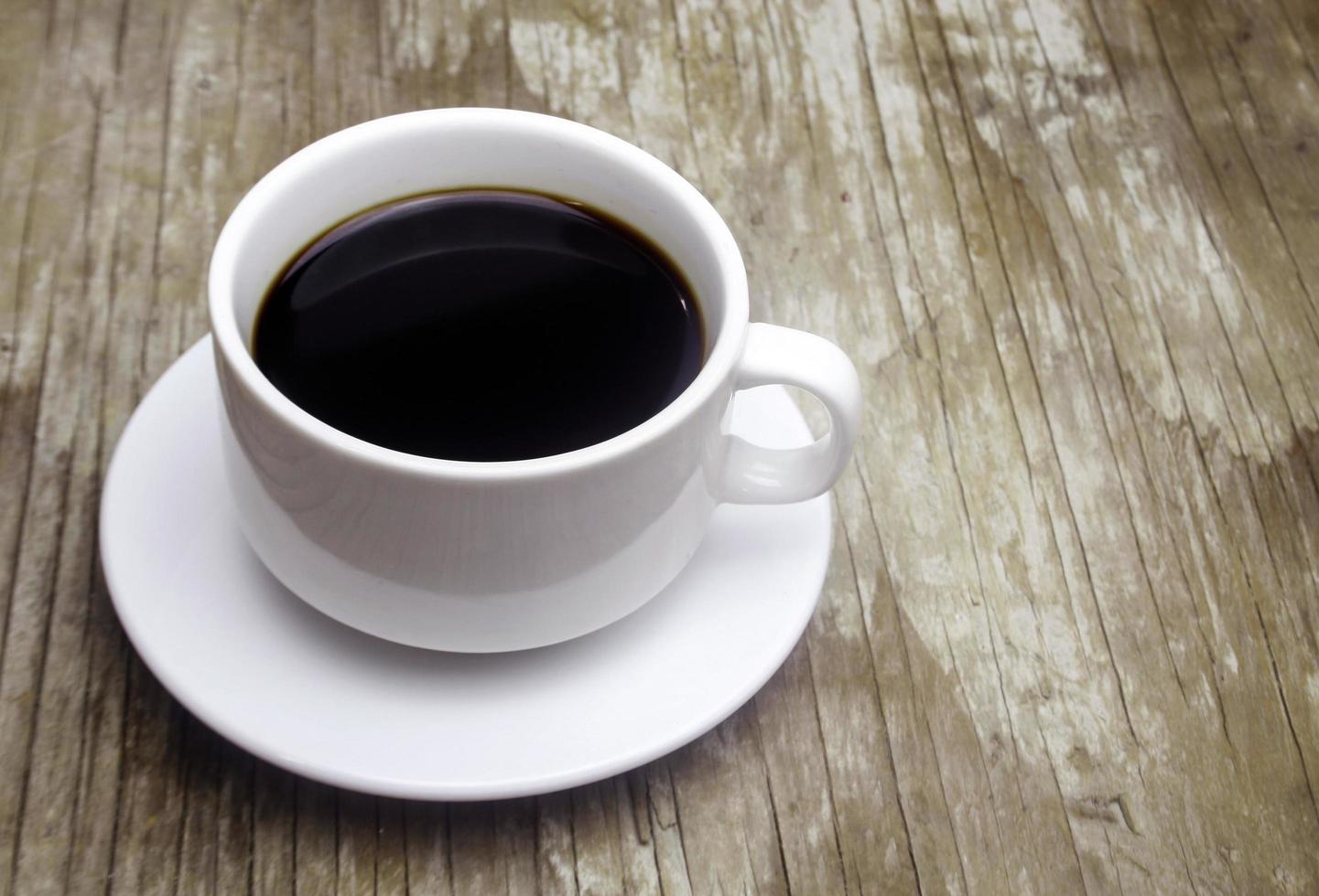 Coffee on wooden table photo