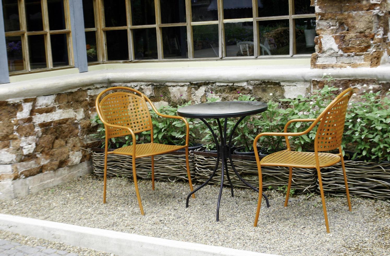 Two chairs and a table photo