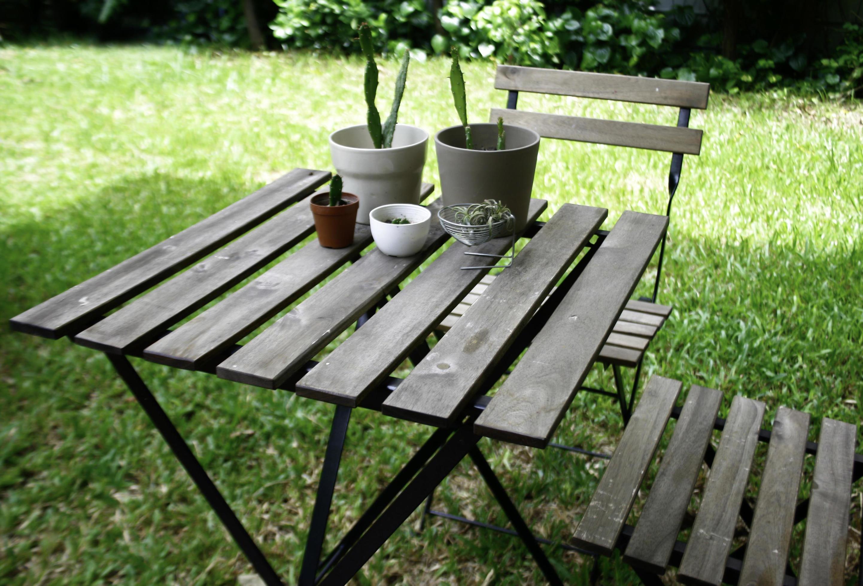 Outdoor table and chairs in grass 1960257 Stock Photo at Vecteezy
