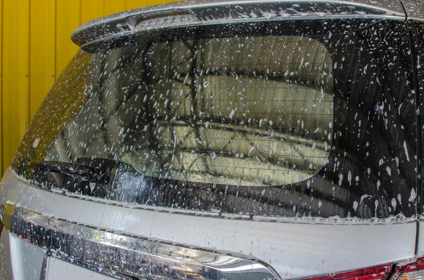 Silver car being washed photo