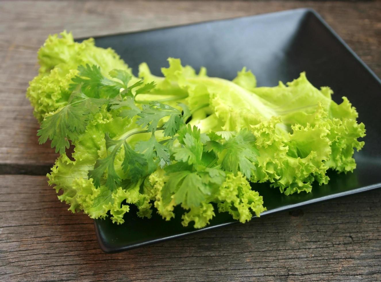 Lettuce on black plate photo