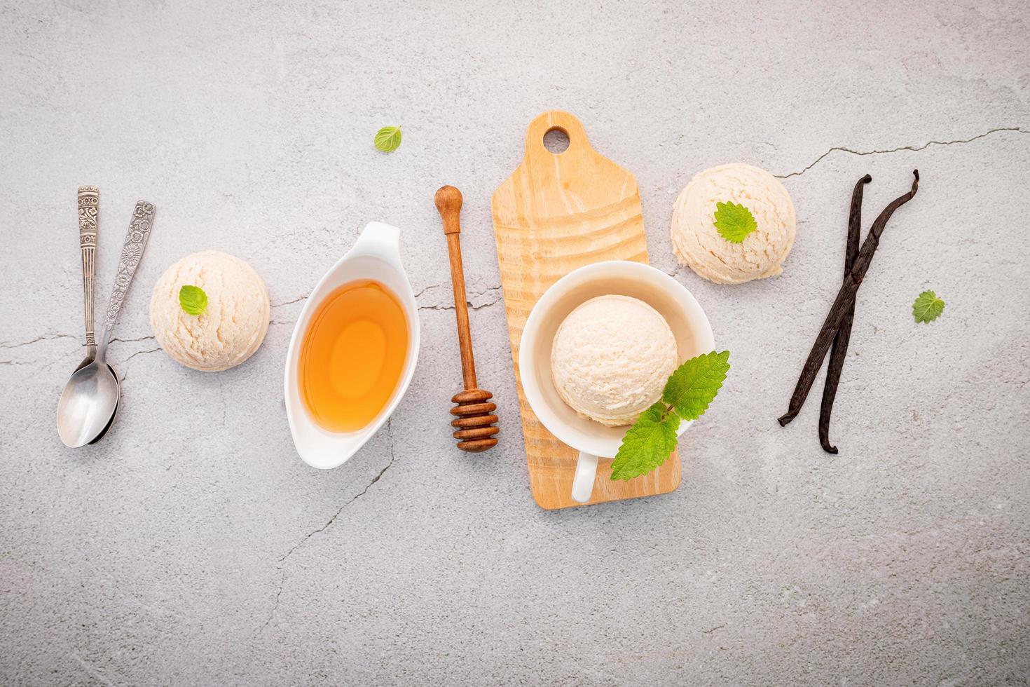 Vanilla ice cream with spoons and decorations photo