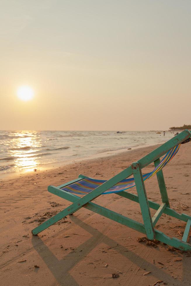 Sunbathing chair on the beach photo