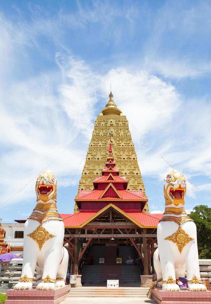 Large yellow pagoda of Temple Sagklaburi photo