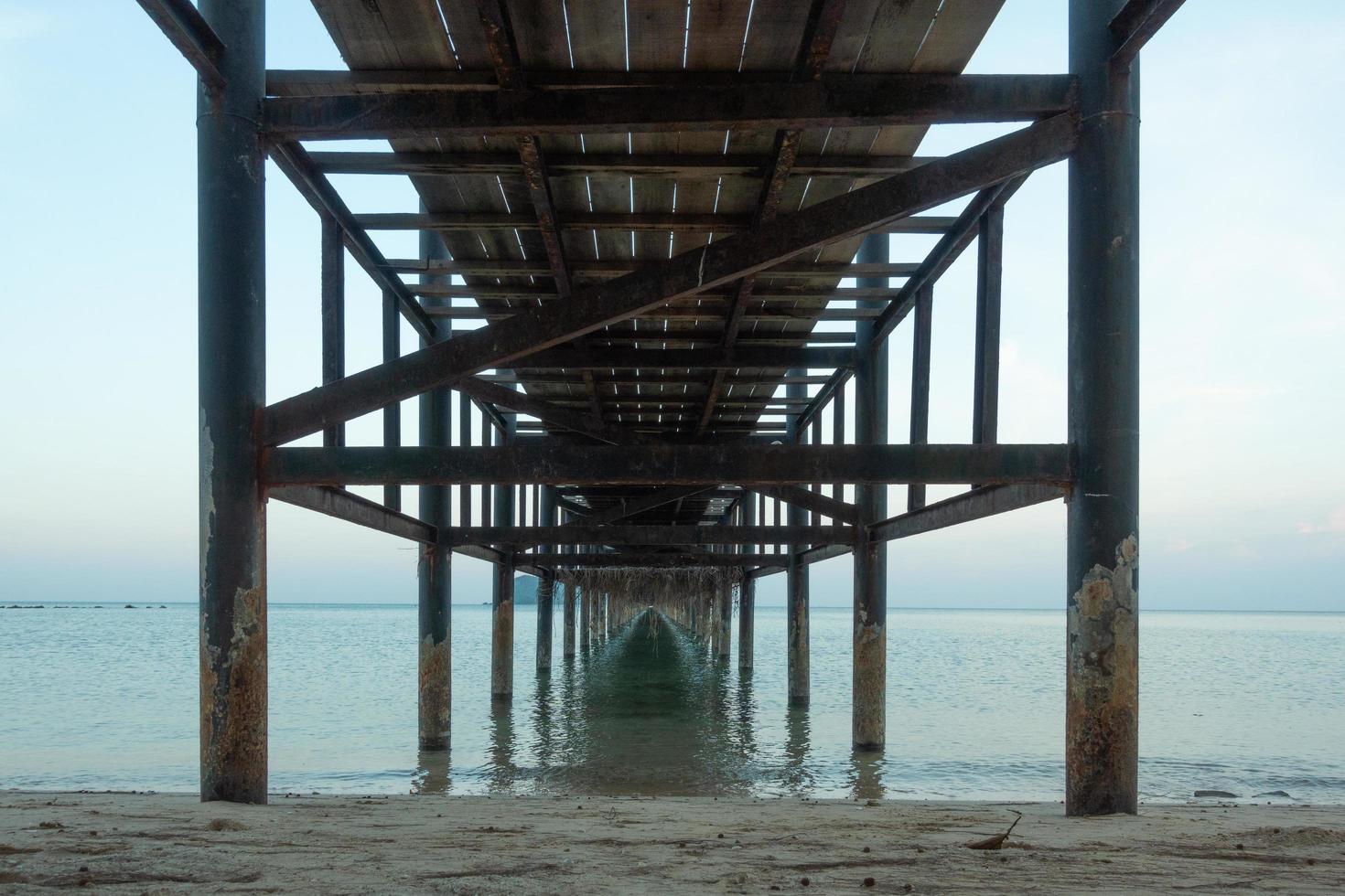 Wooden pier and beach photo