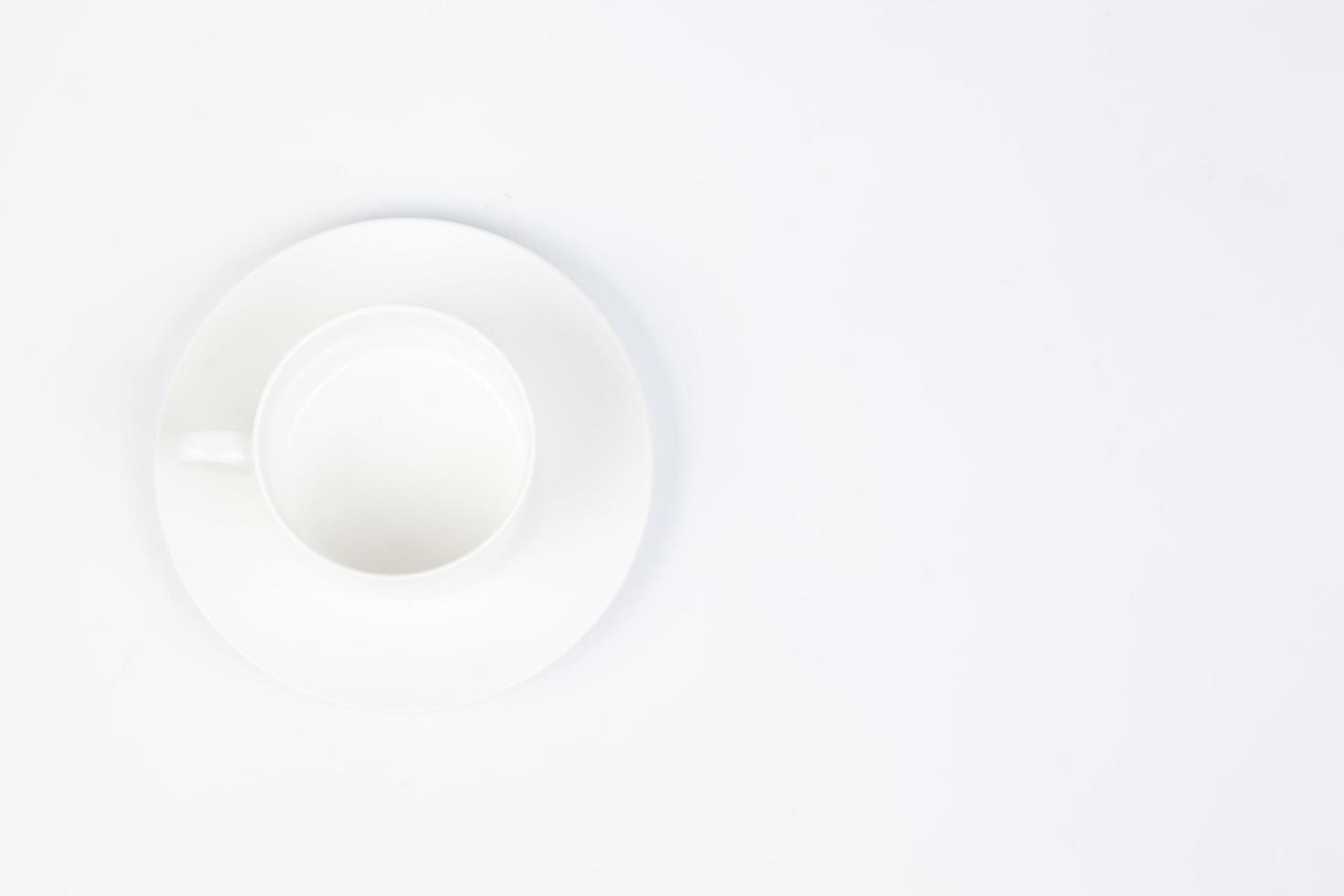 Coffee cup and saucer on white background photo