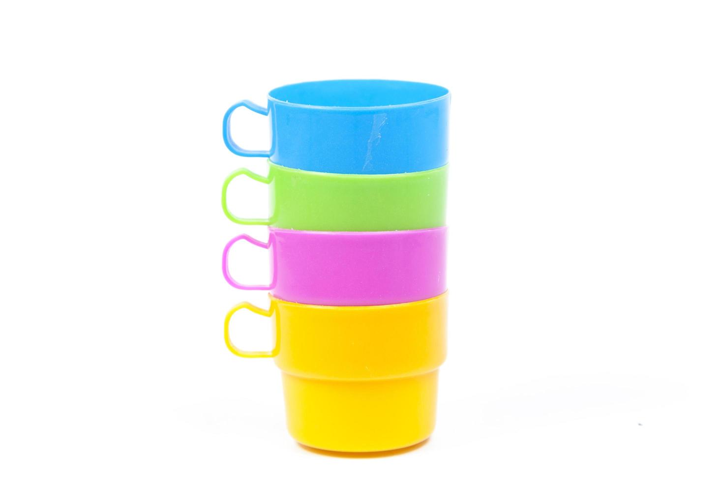 Plastic cups on white background photo