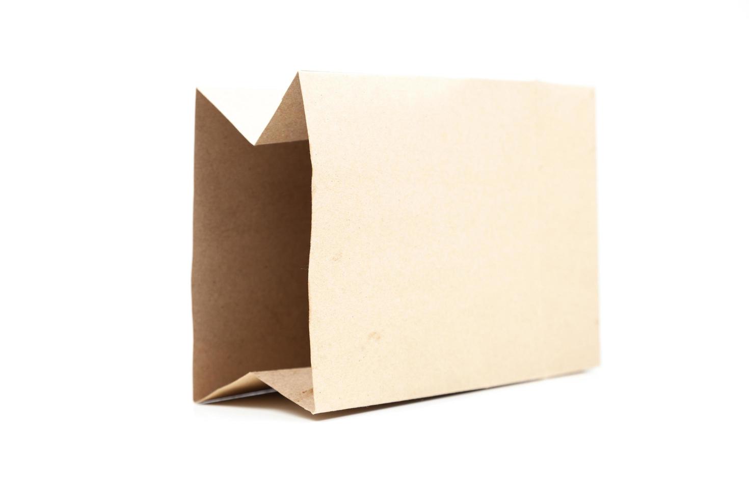 Brown paper bag on white background photo