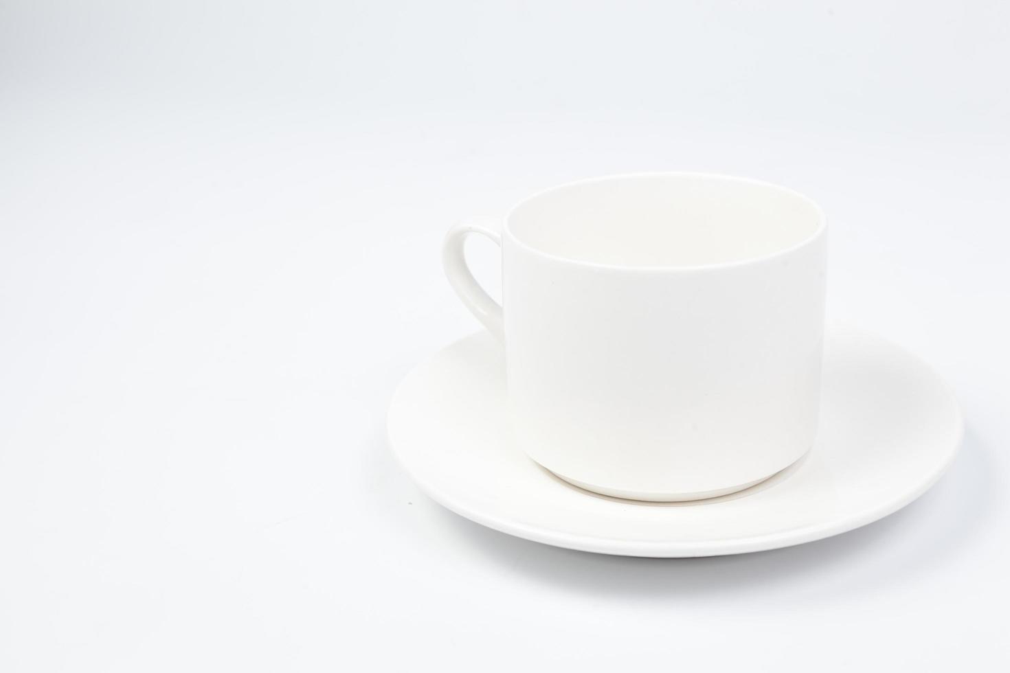 Coffee cup and saucer on white background photo