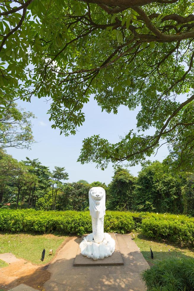 Merlion statue in a park in Singapore photo