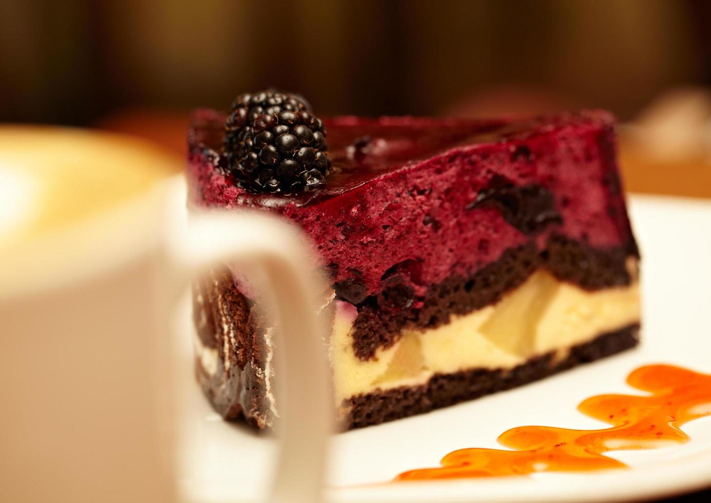 Blackberry cheesecake on plate photo