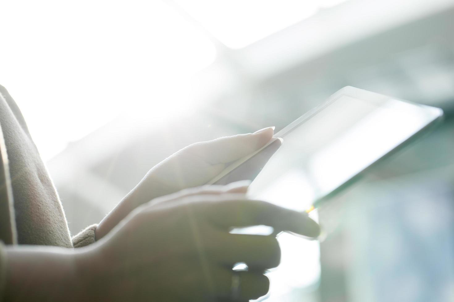 Woman using tablet computer photo