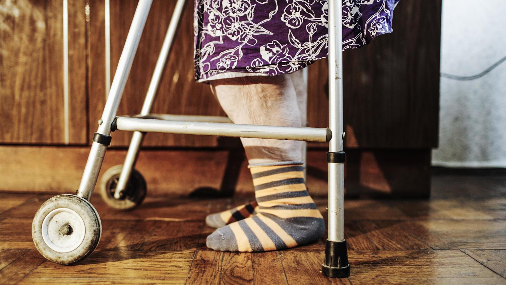 Elderly woman with walker photo