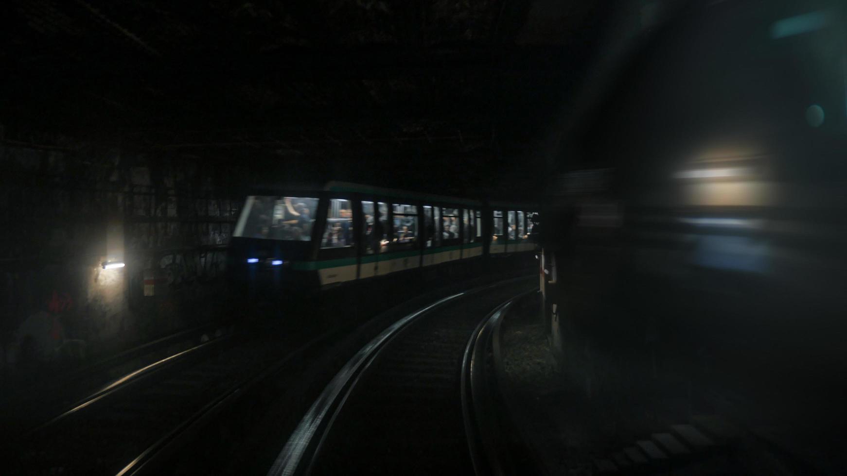 Paris, France, 2020 - Train moving through a tunnel photo