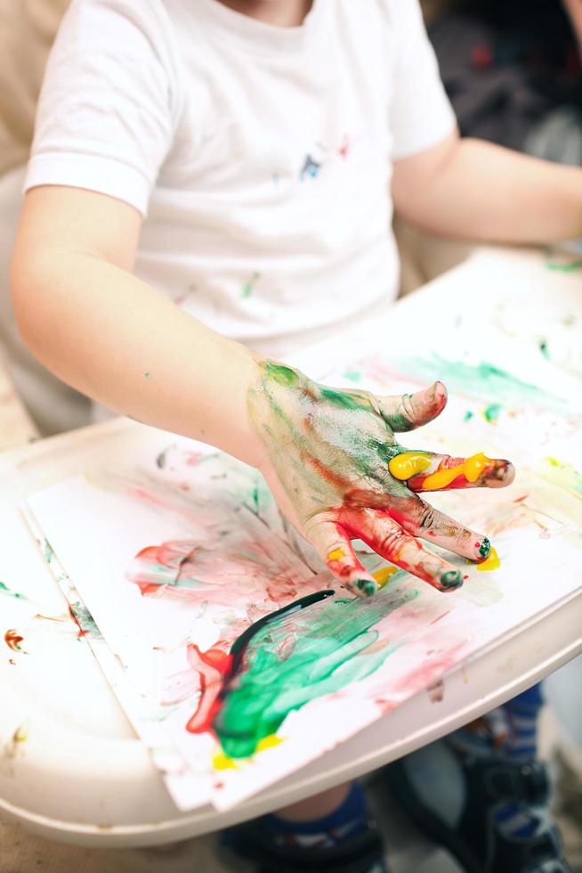 Child finger painting photo