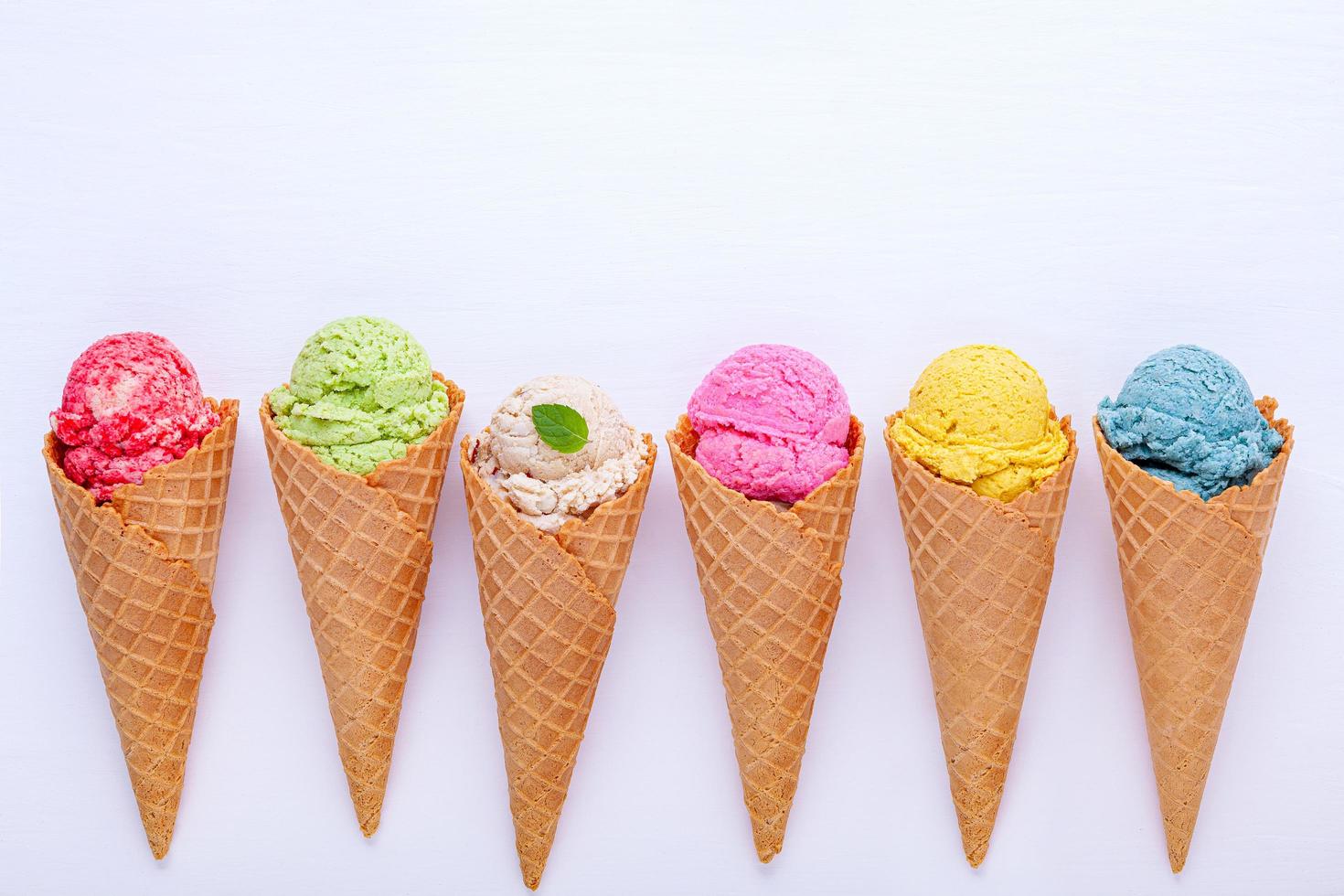 Various of ice cream flavor in cones photo