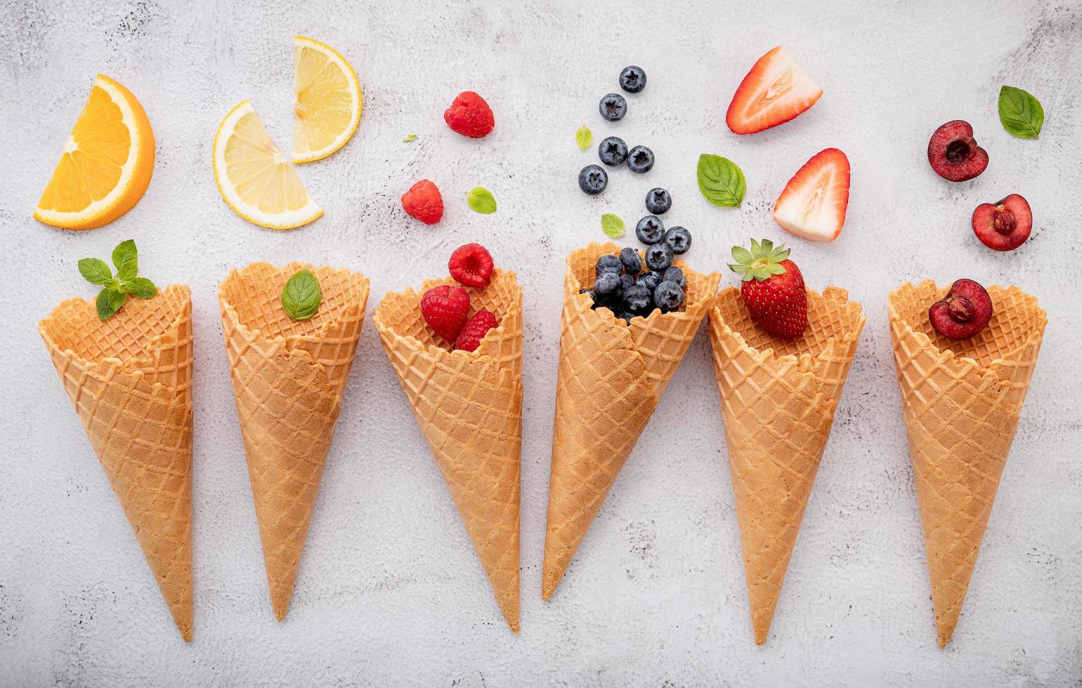 Various of fruits in cones photo