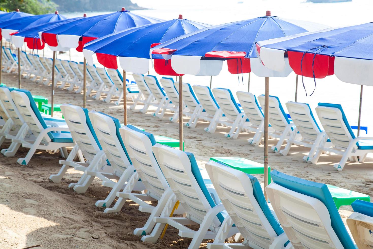 Sunbathing beds and umbrellas in Thailand photo