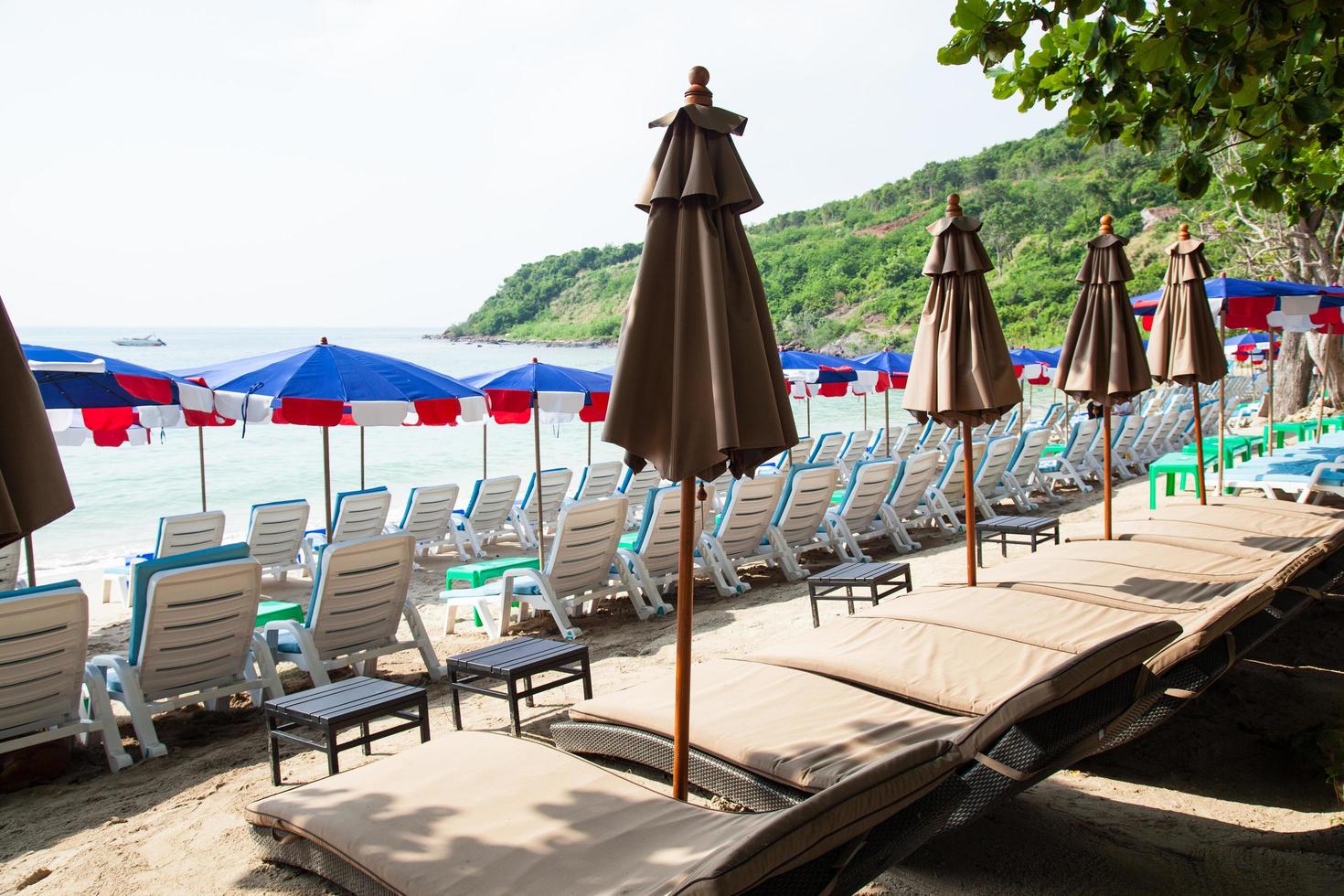 Sunbathing beds and umbrellas in Thailand photo