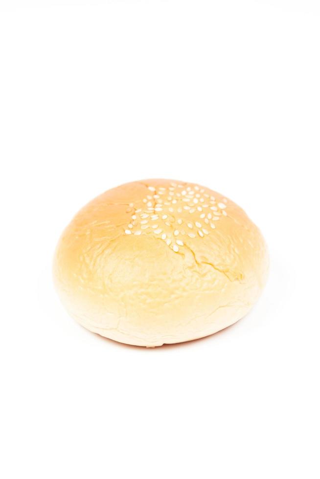 Round loaf of bread on white background photo