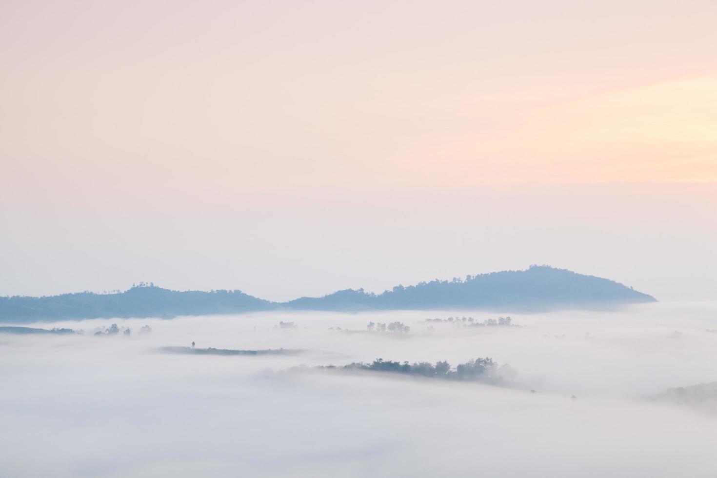 Fog covered mountains photo