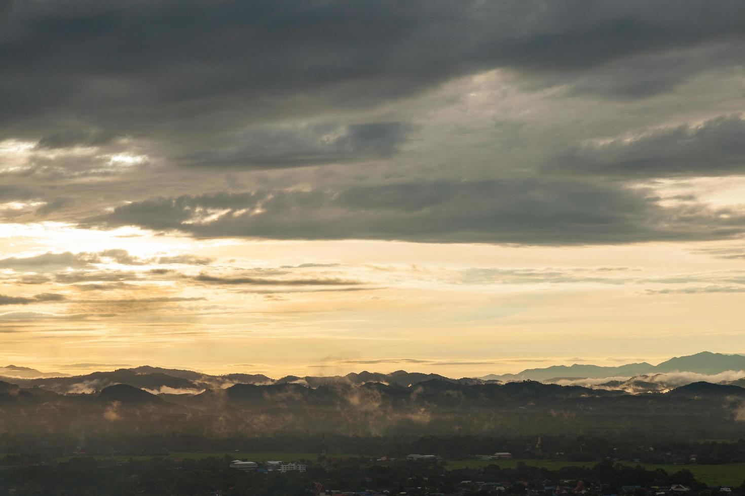 Mountains and clouds at sunrise photo