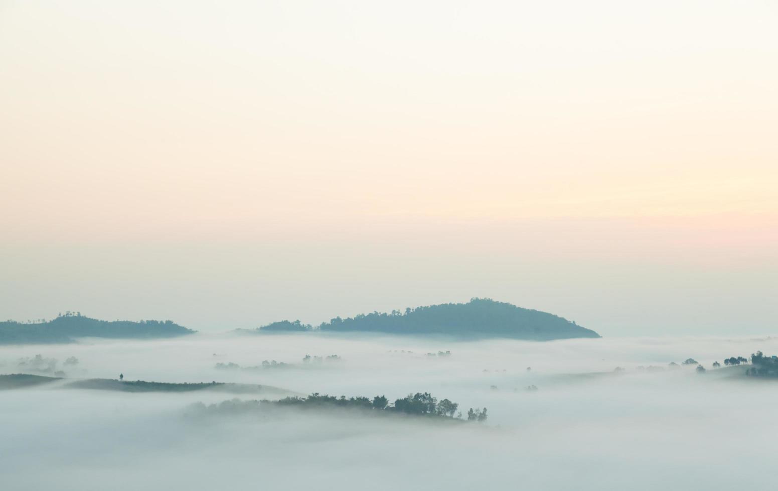 Fog covered mountains photo