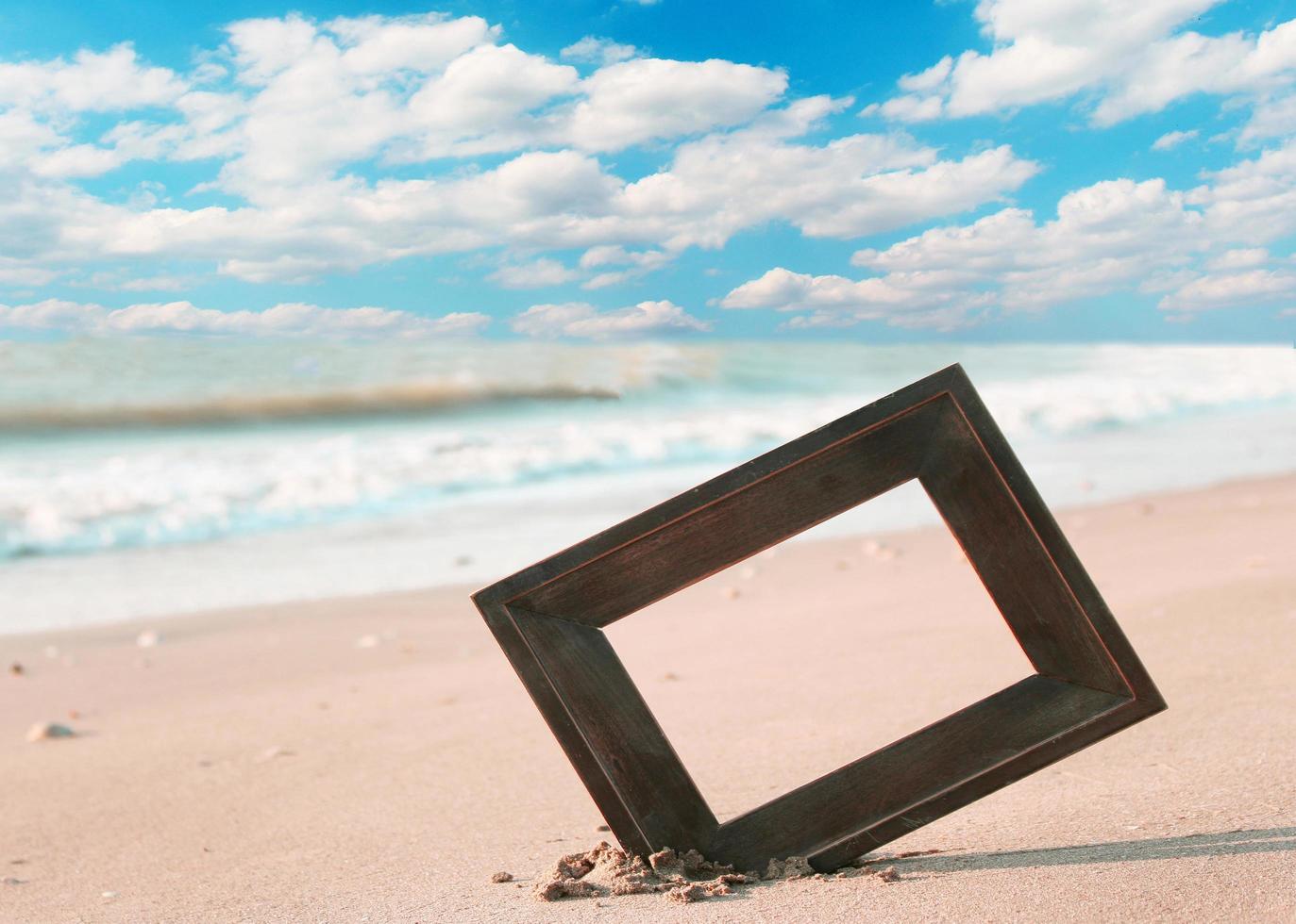 Photo frame on beach