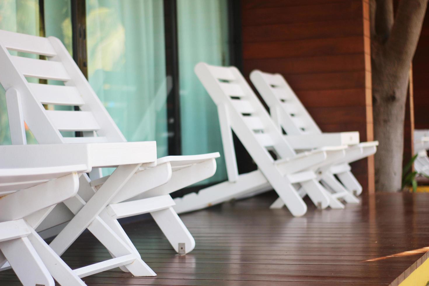 White chairs on deck photo