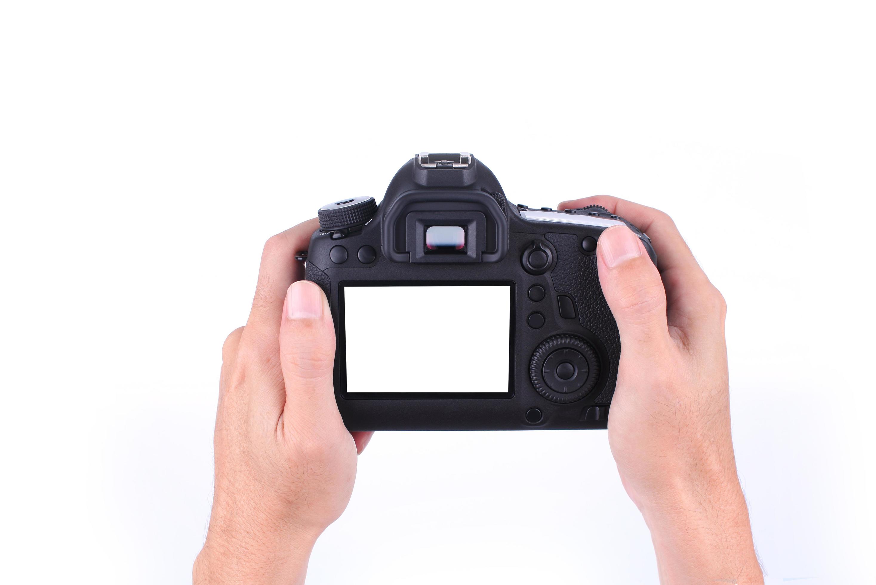 Hands holding DSLR camera on white background 1963899 Stock Photo at  Vecteezy