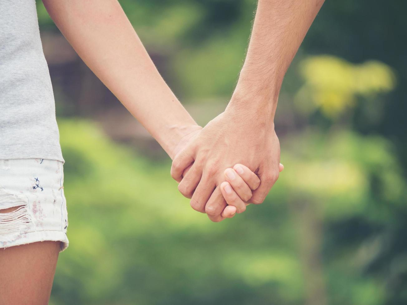 Image of a couple holding hands together photo