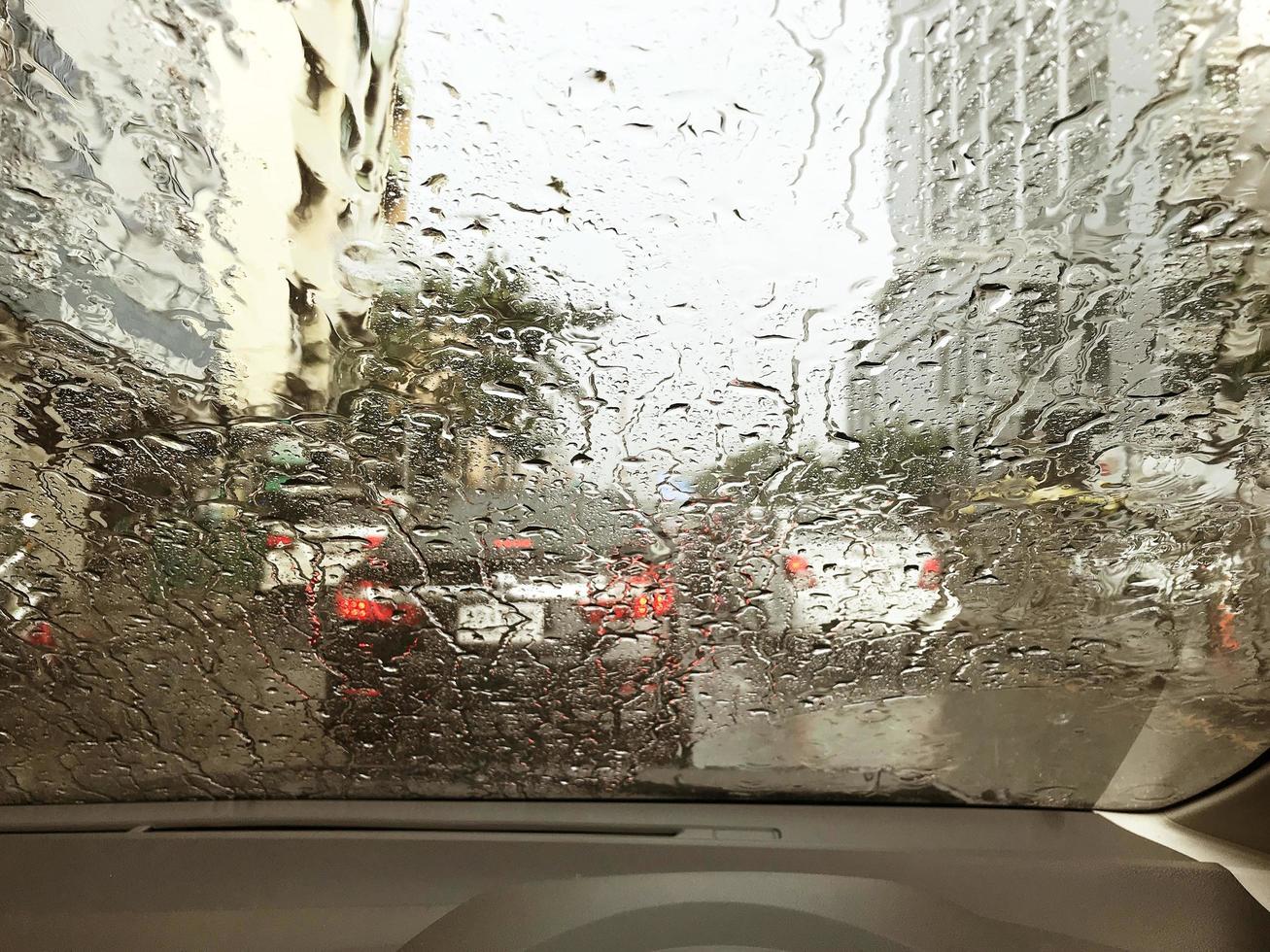 Busy road through rainy windshield photo