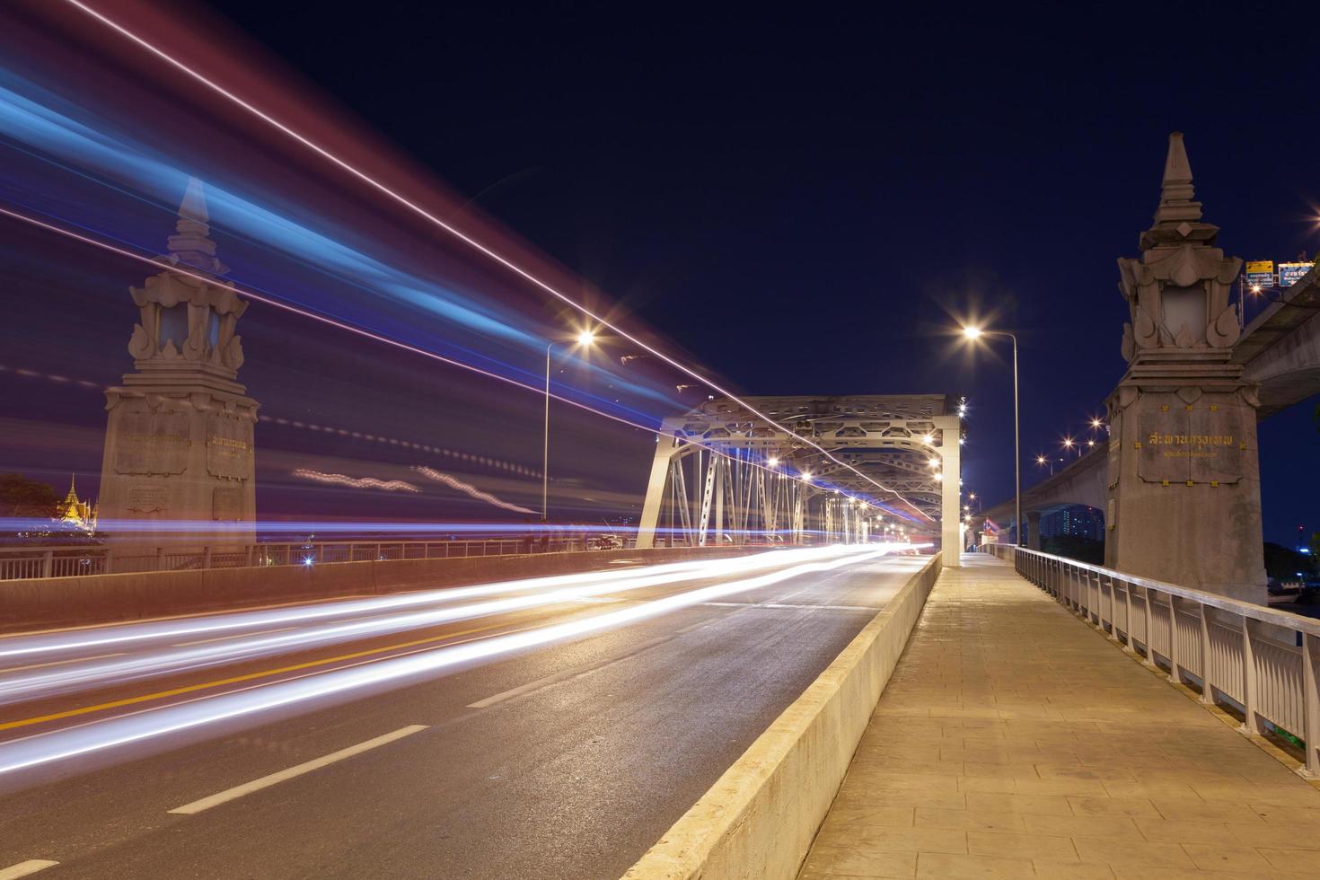 Traffic on the bridge at night photo