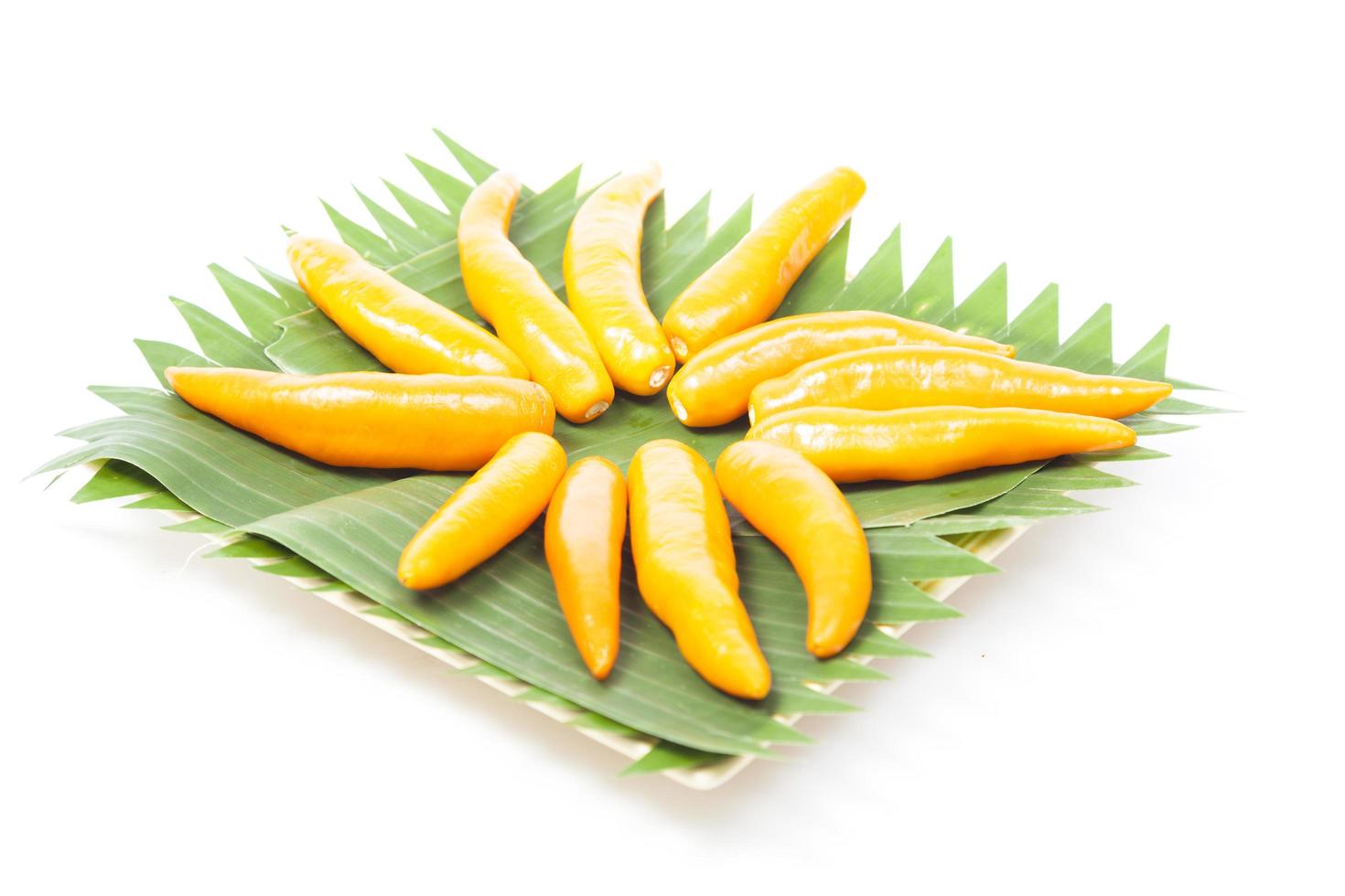 Yellow sweet peppers on a plate photo