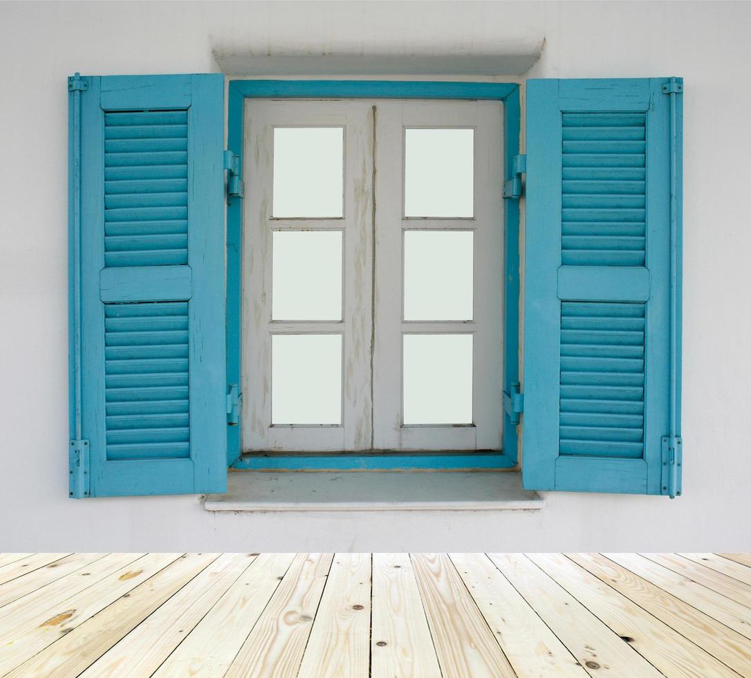 Blue shutters on window photo