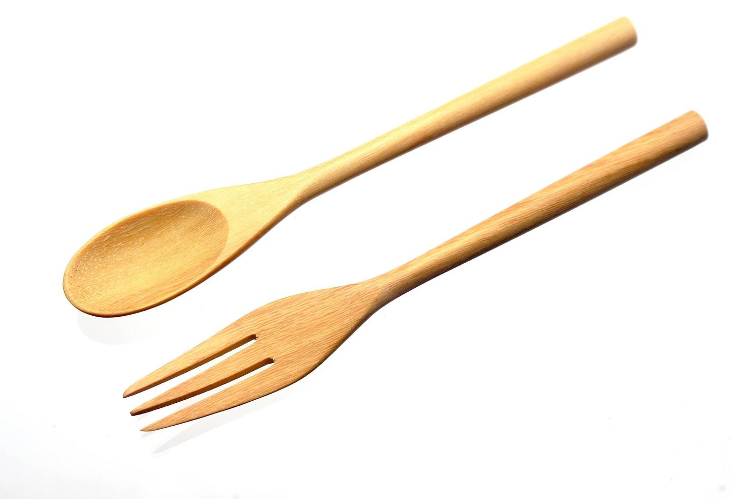 Wooden fork and spoon on white photo