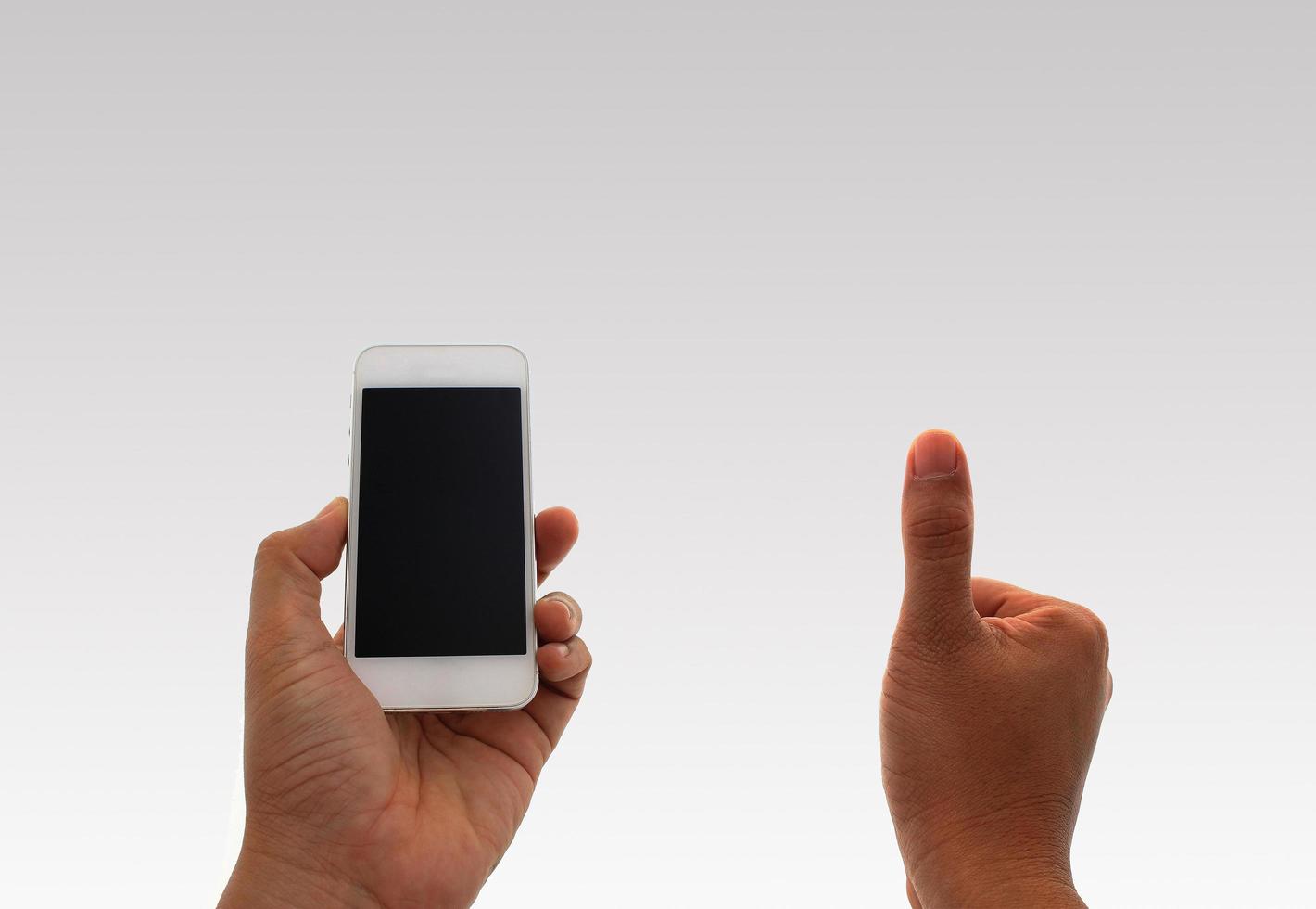 Man using phone and giving thumbs-up photo