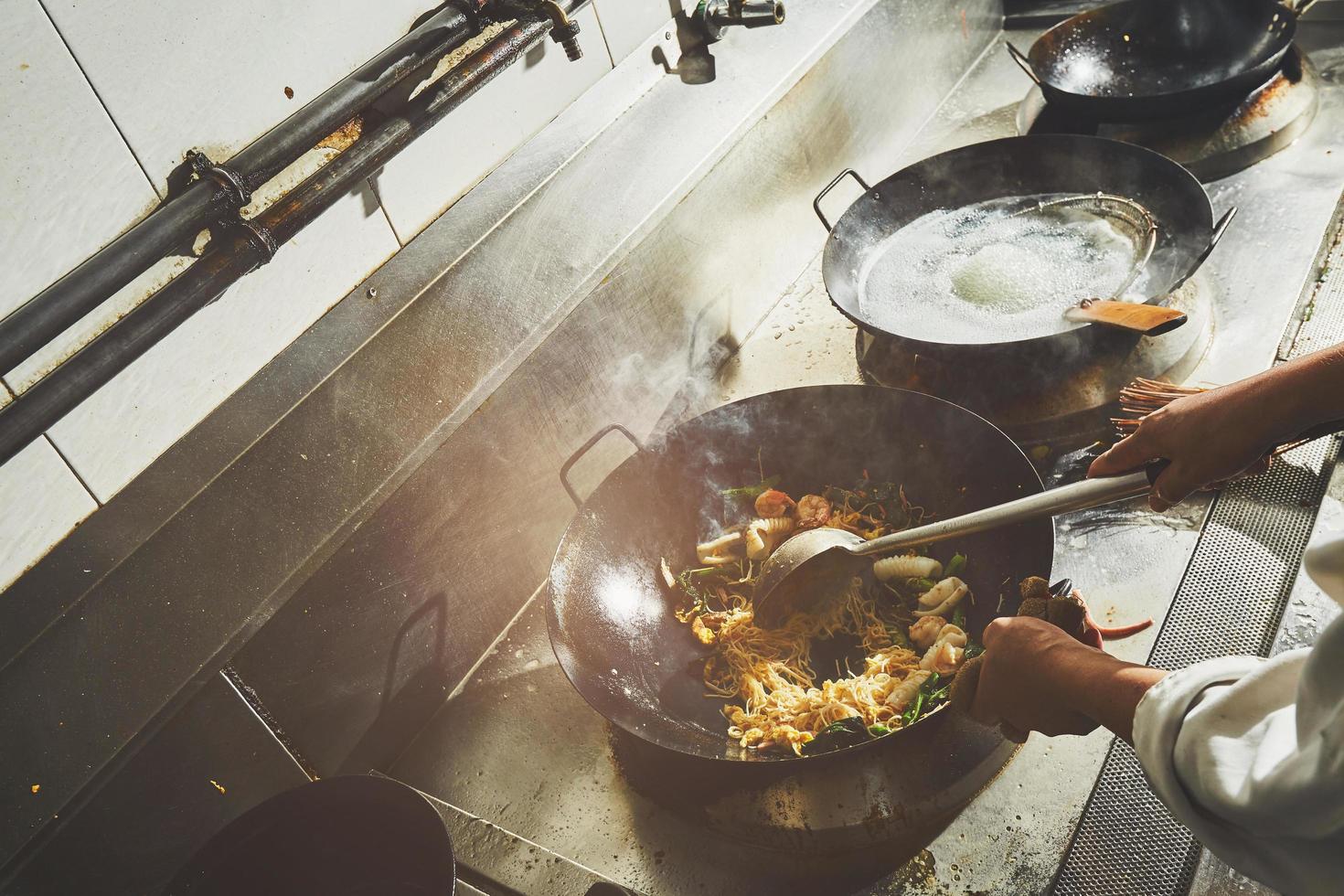 Chef stir frying food photo