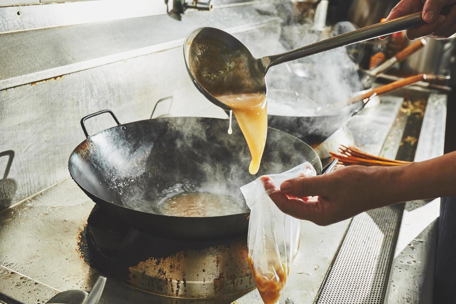 Chef putting food into bag photo