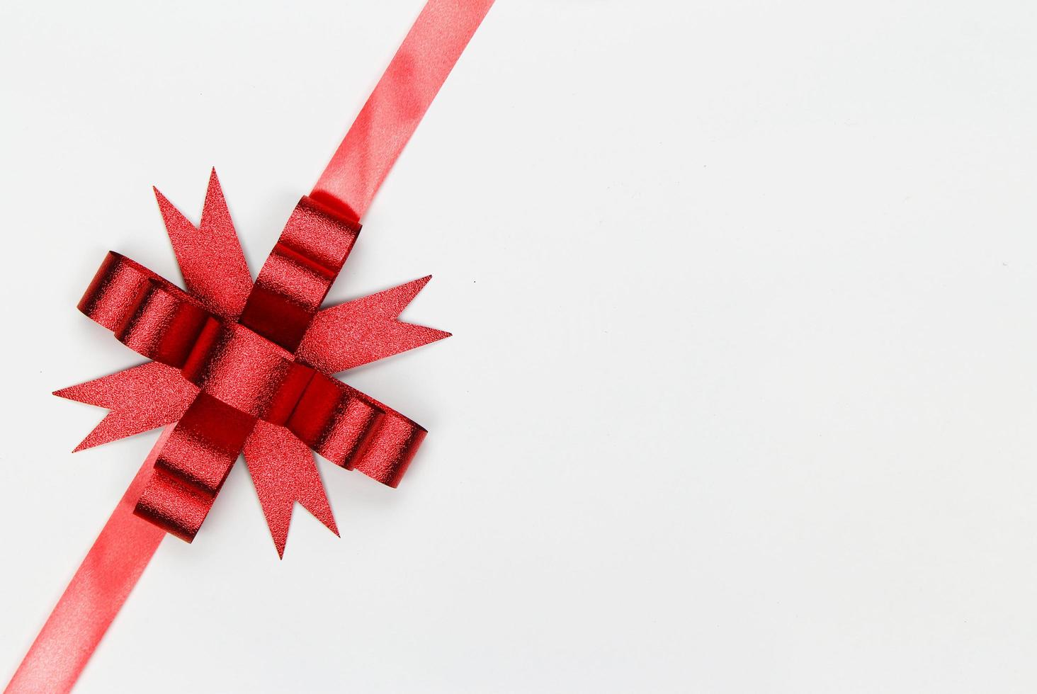 Red bow on white background photo