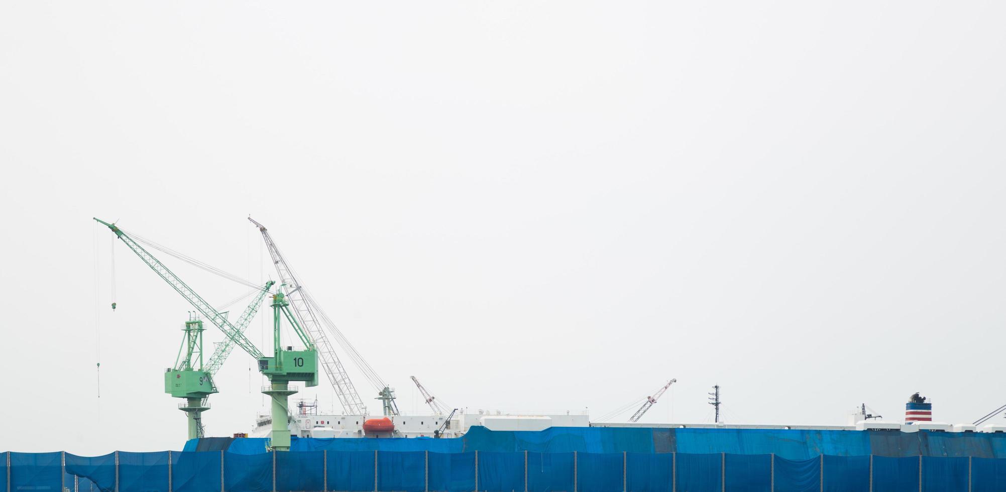 Cranes in the harbor in Bangkok photo