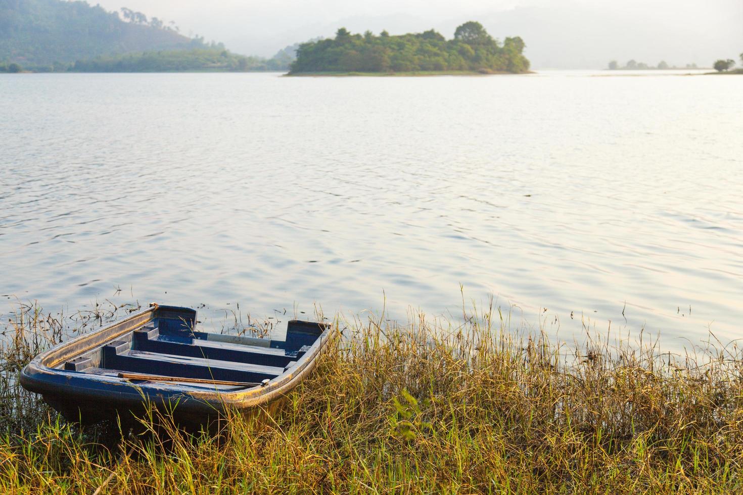 Boat on the shore of the lake photo