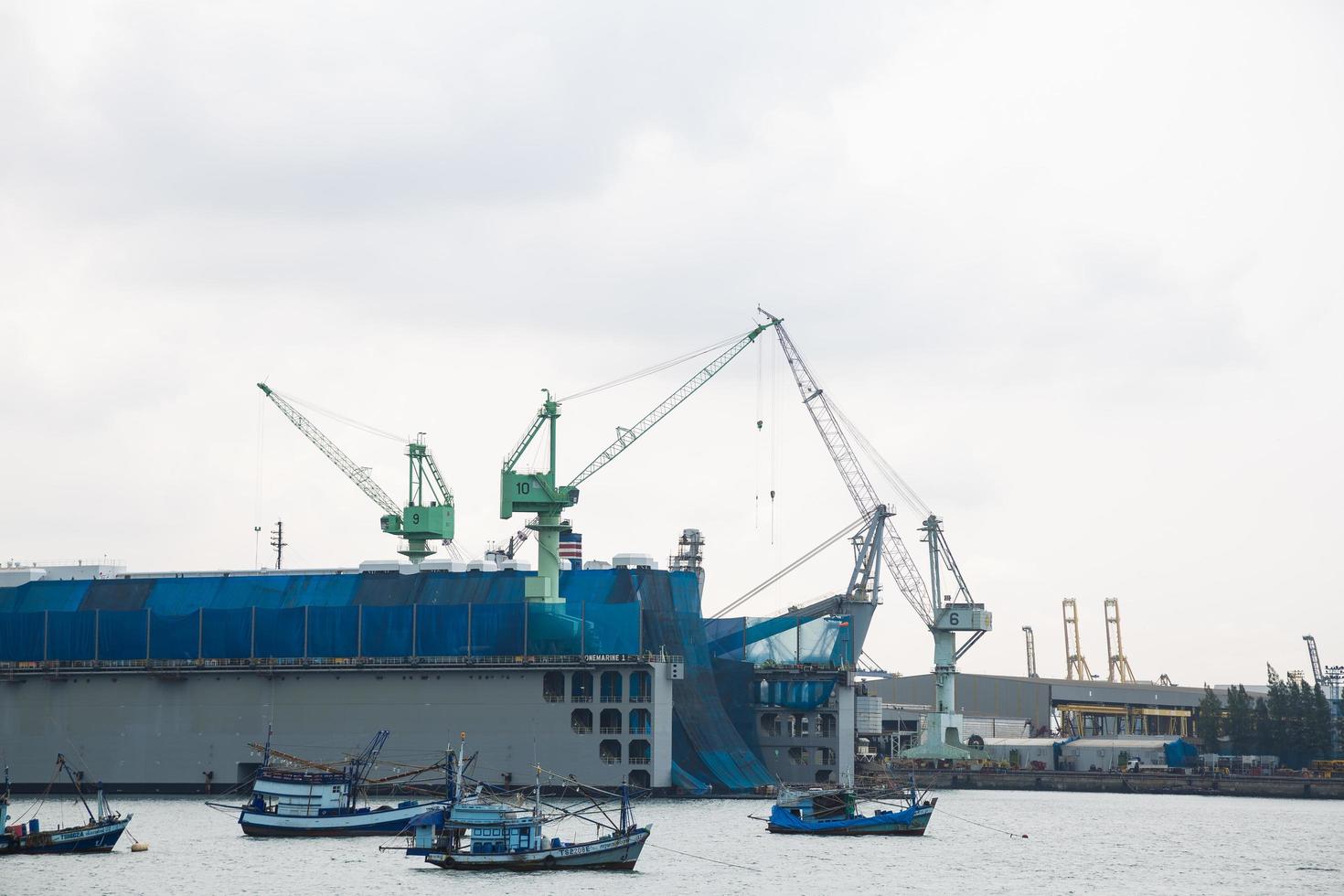 Cranes in the harbor in Bangkok photo