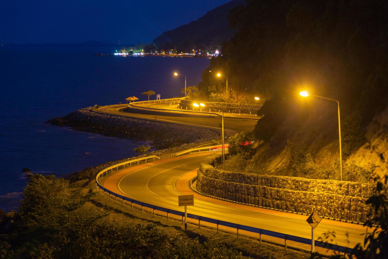 Curved road by the sea photo